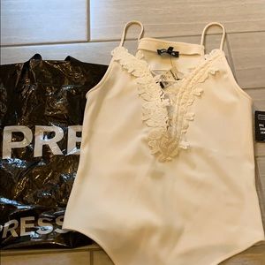 Cream colored body suit